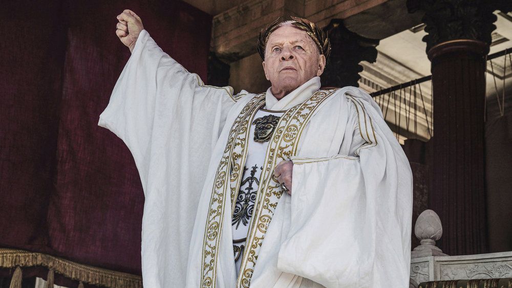 Anthony Hopkins wearing white robes as Vespasian in Peacock Original &quot;Those About to Die&quot;