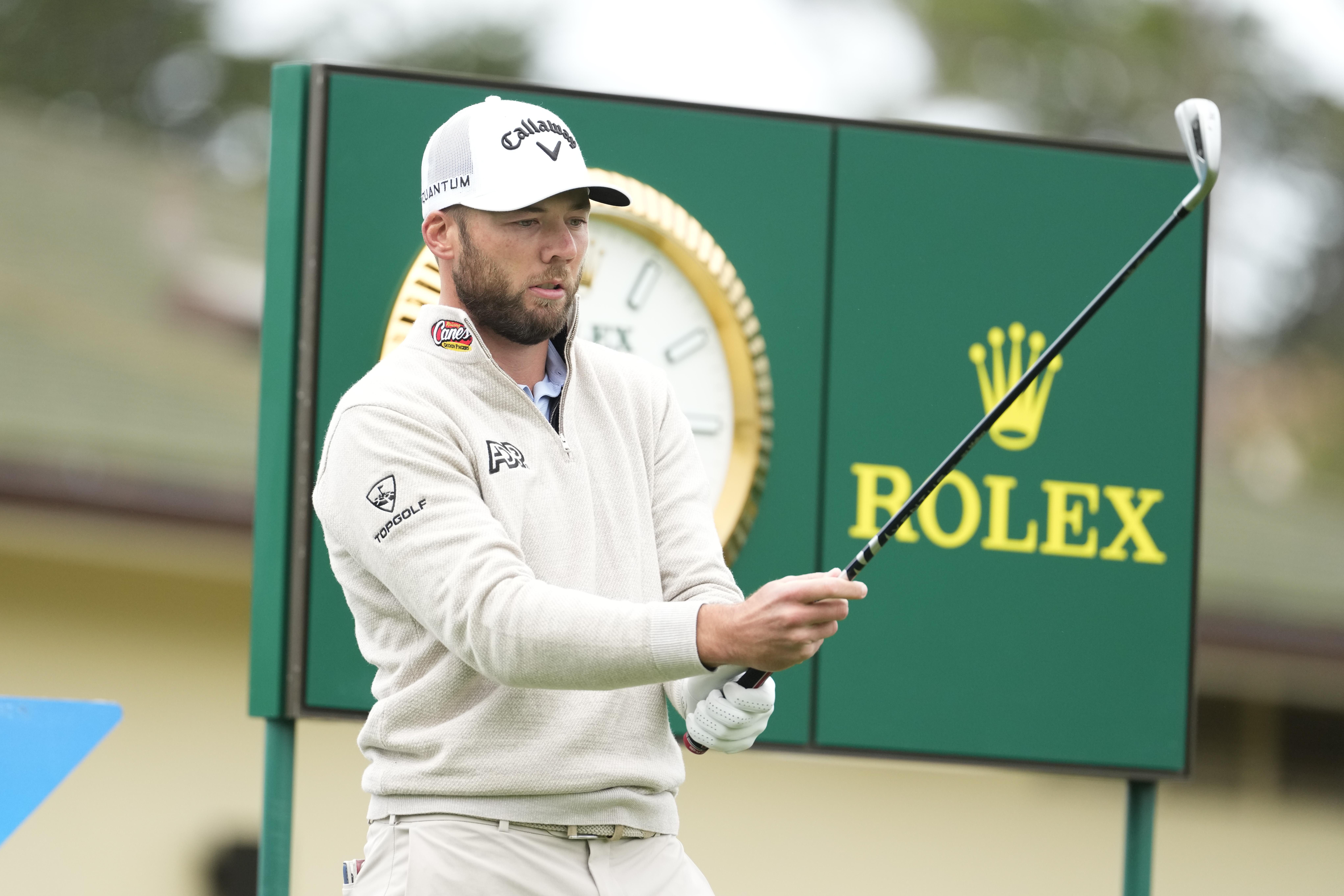 Sam Burns prepares to hit his tee shot on the first hole during the final round of AT&T Pebble Beach Pro-Am at Pebble Beach Golf Links