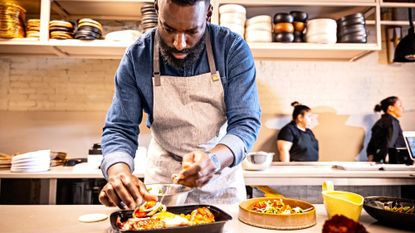 Chef Eric Adjepong in the kitchen of his new restaurant, Elmina, photographed March 8, 2025 in Washington, DC.