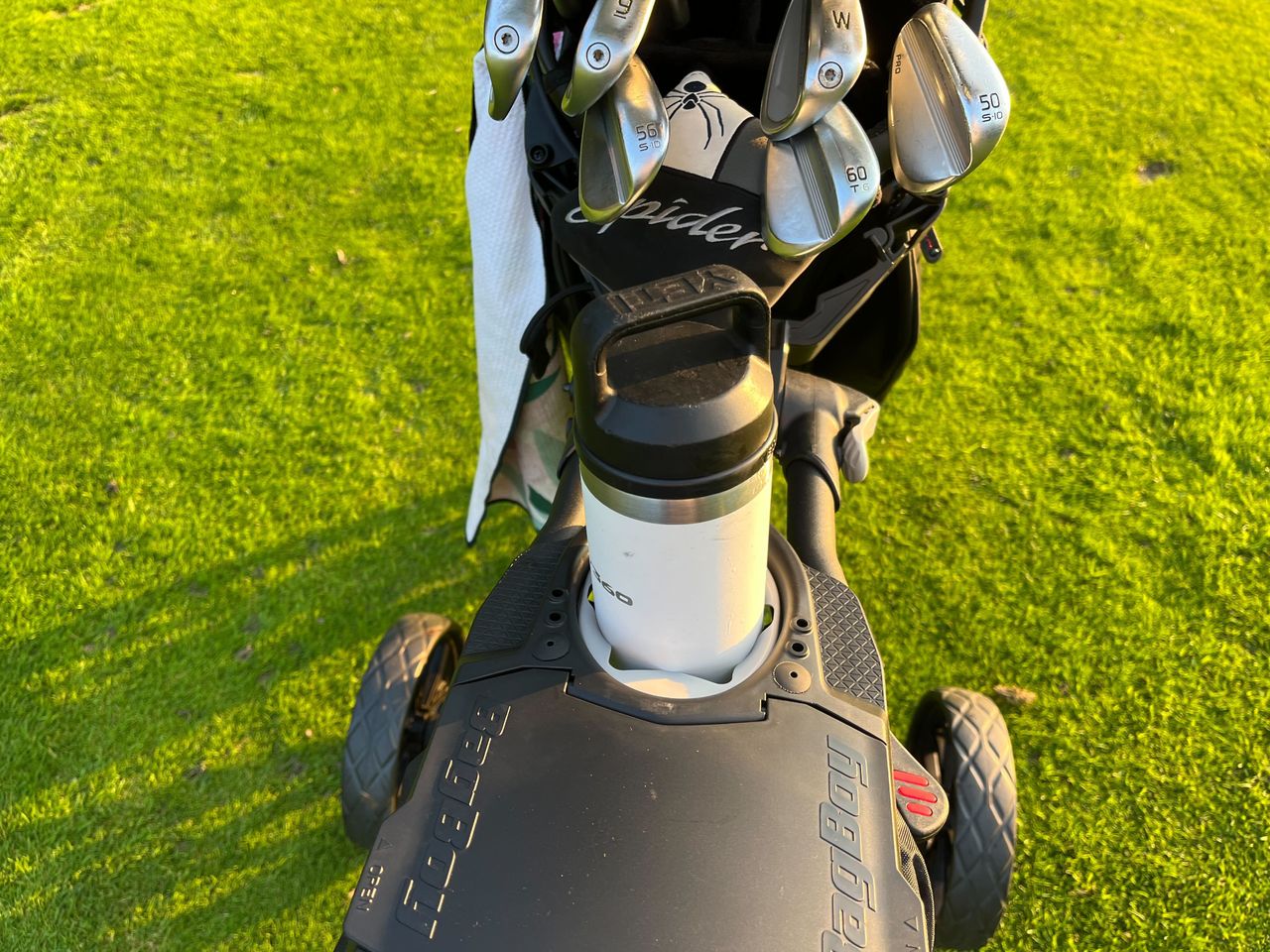 The water bottle holder on the BagBoy slimfold push cart