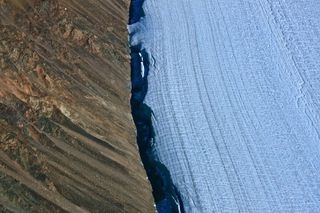 Areal view of the Sverdrup Glacier, a river of ice that flows from the interior of the Devon Island Ice Cap into the ocean. Nunavut, Canada.