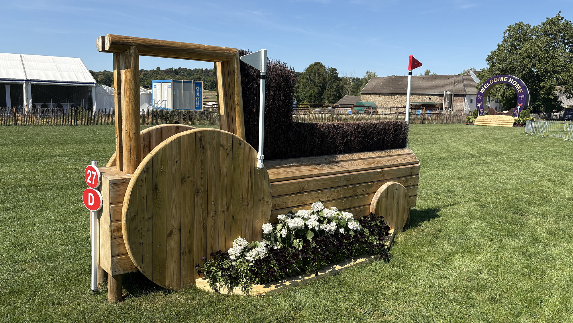 An angled brush fences shaped like a tractor on the eventing World Championships cross-country course