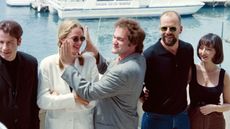 Director Quentin Tarantino (centre) and the cast of Pulp Fiction at Cannes in 1994: (from left to right) John Travolta, Uma Thurman, Tarantino, Bruce Willis and Maria de Medeiros