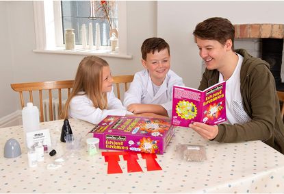 Fun activities for kids: Galt Toys Horrible Science Explosive Experiments: girl, boy and man playing with the kit on table