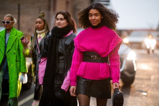 Sara Flaaen Licius seen wearing pink belted jumper, black skirt outside Jade Cropper during Copenhagen Fashion Week Autumn/Winter 2022 on February 03, 2022 in Copenhagen, Denmark