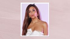 Eva Longoria attends La Môme 10 year anniversary dinner celebration on May 17, 2025 in Cannes, France wearing a white asymmetric dress with glossy curled hair, pink-painted template behind photo.