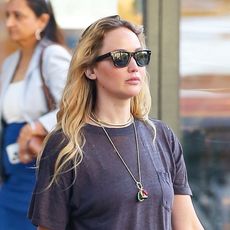 Jennifer Lawrence wearing black sunglasses and a black T-shirt in NYC