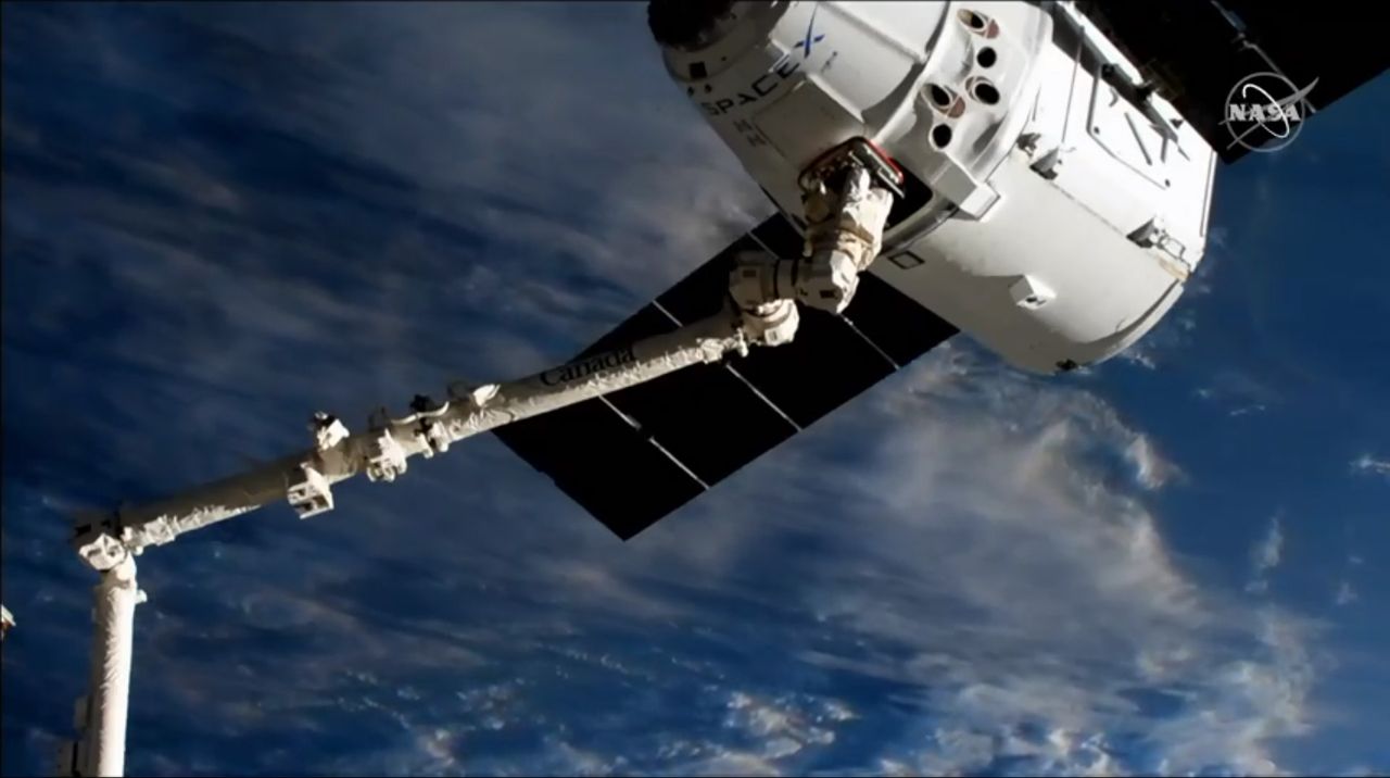A previously flown Dragon cargo ship arrives at the International Space Station carrying 5,000 lbs. of supplies on the CRS-18 mission for NASA on July 27, 2019.