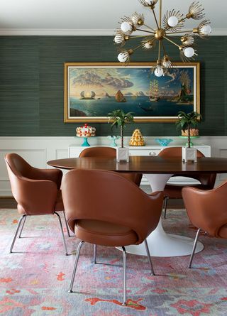 green dining room with tan chairs