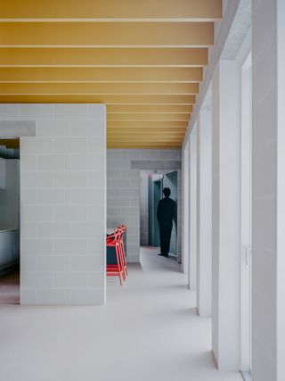 Triangle House by Artefact showing colour interiors and a graphic architectural approach that blends rawness and colour