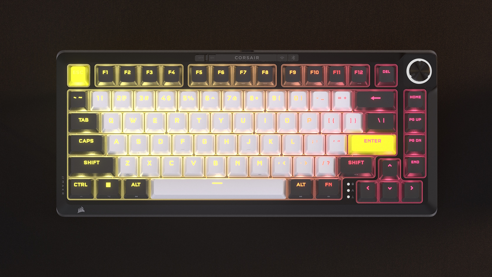 A Corsair MAKR Pro 75 gaming keyboard, shown top-down on a brown surface.