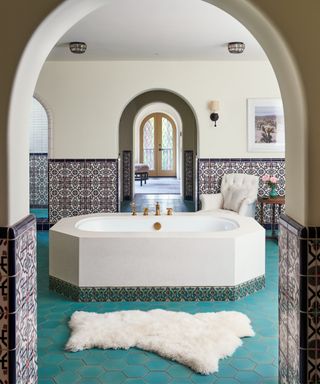 Spanish Colonial bathroom with blue floor tiles and patterned wall tiles