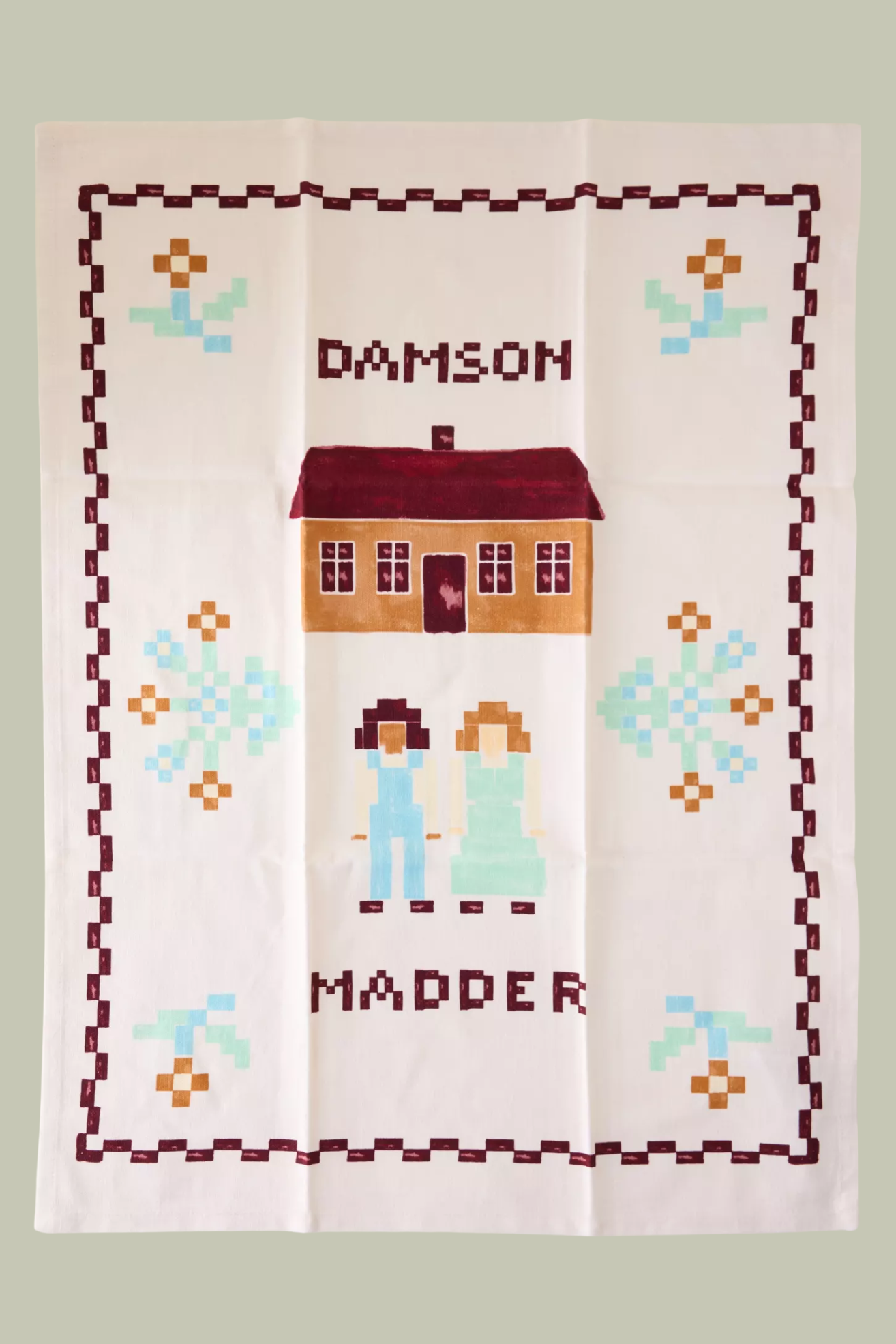 A tea towel with basketweave style painting