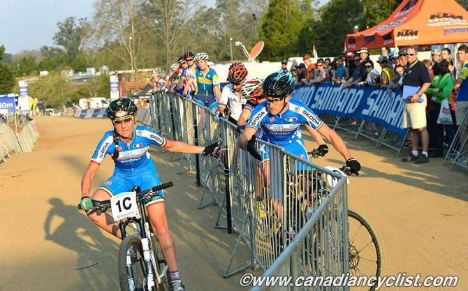 Italy's Eva Lechner hands off to Gerhard Kerschbaumer at the end of lap 3