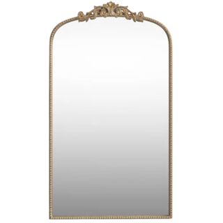 A gold arched mirror