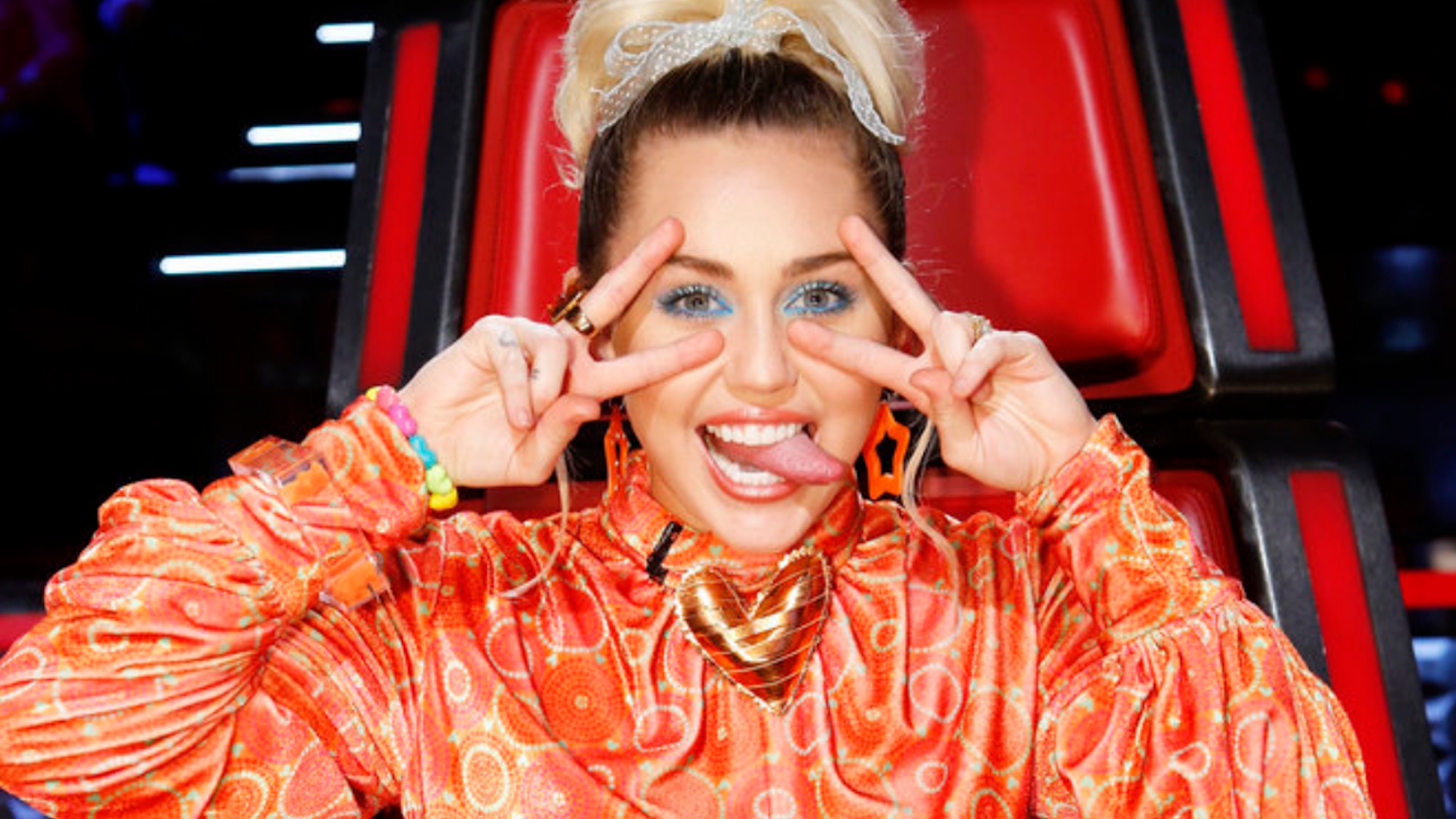 Miley Cyrus is shown on The Voice.