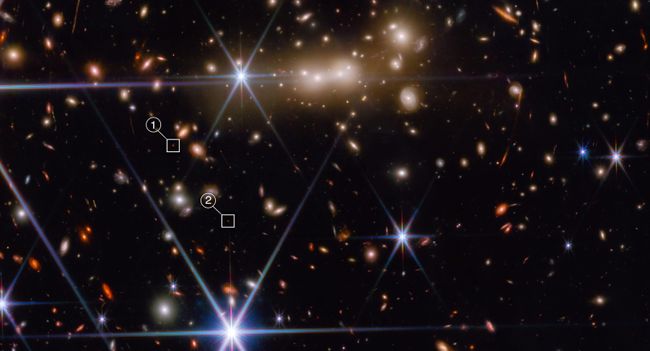 A James Webb Space Telescope image showing numerous stars and celestial objects.
