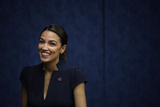 Alexandria Ocasio-Cortez (D-NY) attends a discussion about the potential benefits of a Civilian Climate Corps, at the U.S. Capitol on June 23, 2021 in Washington, DC.
