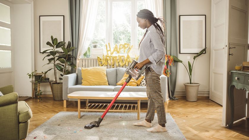 Woman vacuuming up after a party