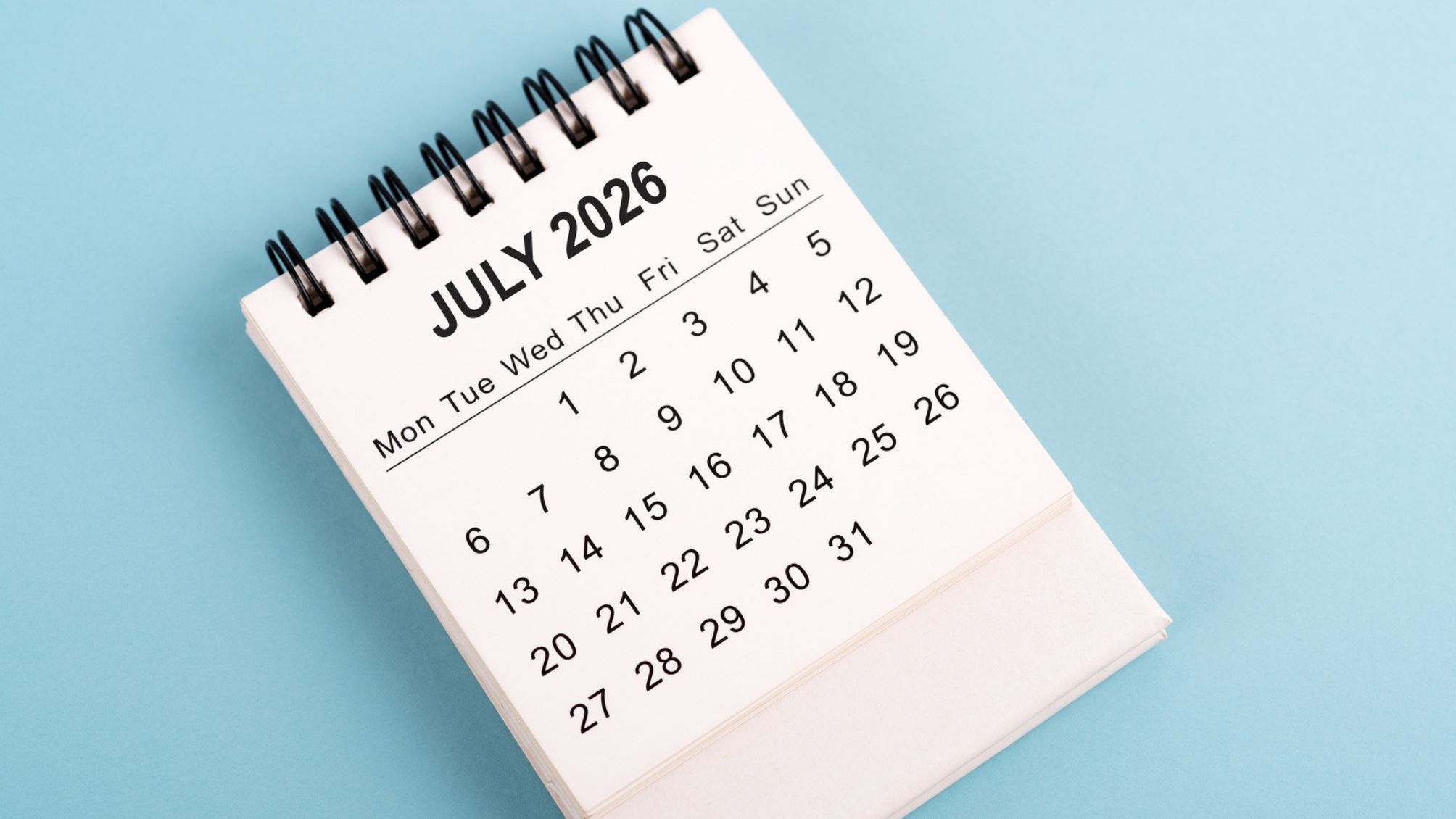 A July 2026 calendar against a blue background