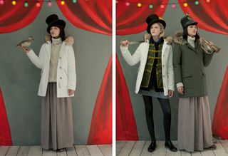 Illustrated grey backdrop with red tied back curtains, colourful lights, wooden floor. Left: female model wearing winter wear, top hat holding a duck. Right: Two female models in winter wear, one holding a sword over her shoulder the other holding a brass trumpet