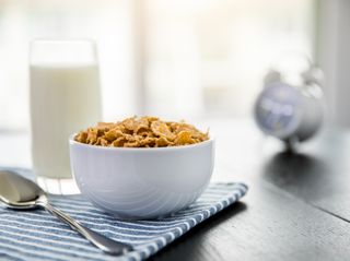 Vitamin D foods: Healthy Corn Flakes with milk for Breakfast on table, food and drink