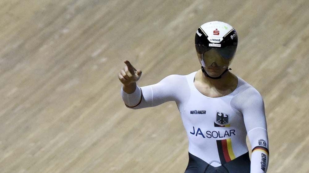 Rene Enders celebrates Germany's win in the team sprint