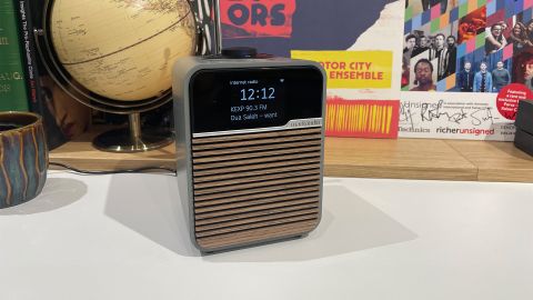 Ruark Audio R1S DAB radio on white shelf next to globe