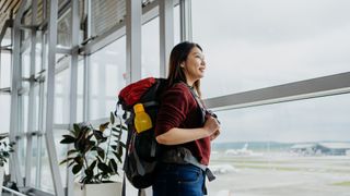 woman with backpack at airport