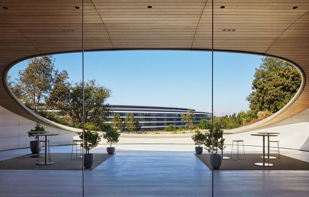 Apple Park Observatory in California, showing flowing, curved lines and a semi buried structure into a hill