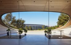 Apple Park Observatory in California, showing flowing, curved lines and a semi buried structure into a hill