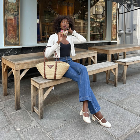 Influencer Emmanuelle Kofi wearing straight jeans and mary-jane heels. 