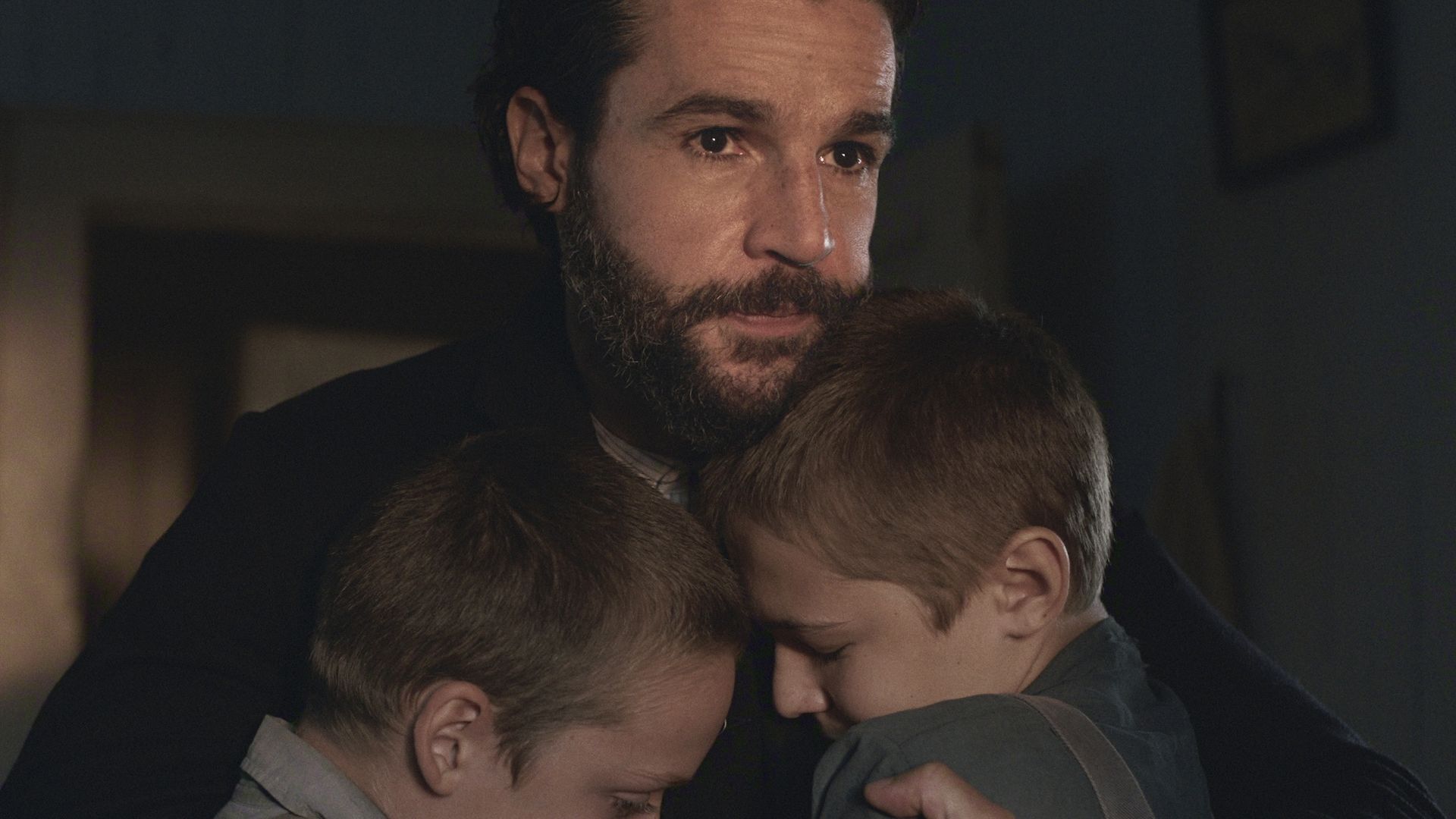 Christopher Abbott as Adam Trask hugging his young sons in East of Eden