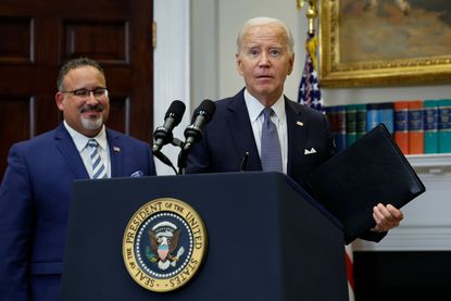 President Joe Biden and Education Secretary Miguel Cardona 