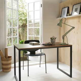 should small rooms be painted in light or dark colours, garden office with plywood wall, dark wood and metal desk, black chair, white tongue and groove walls, French doors to garden