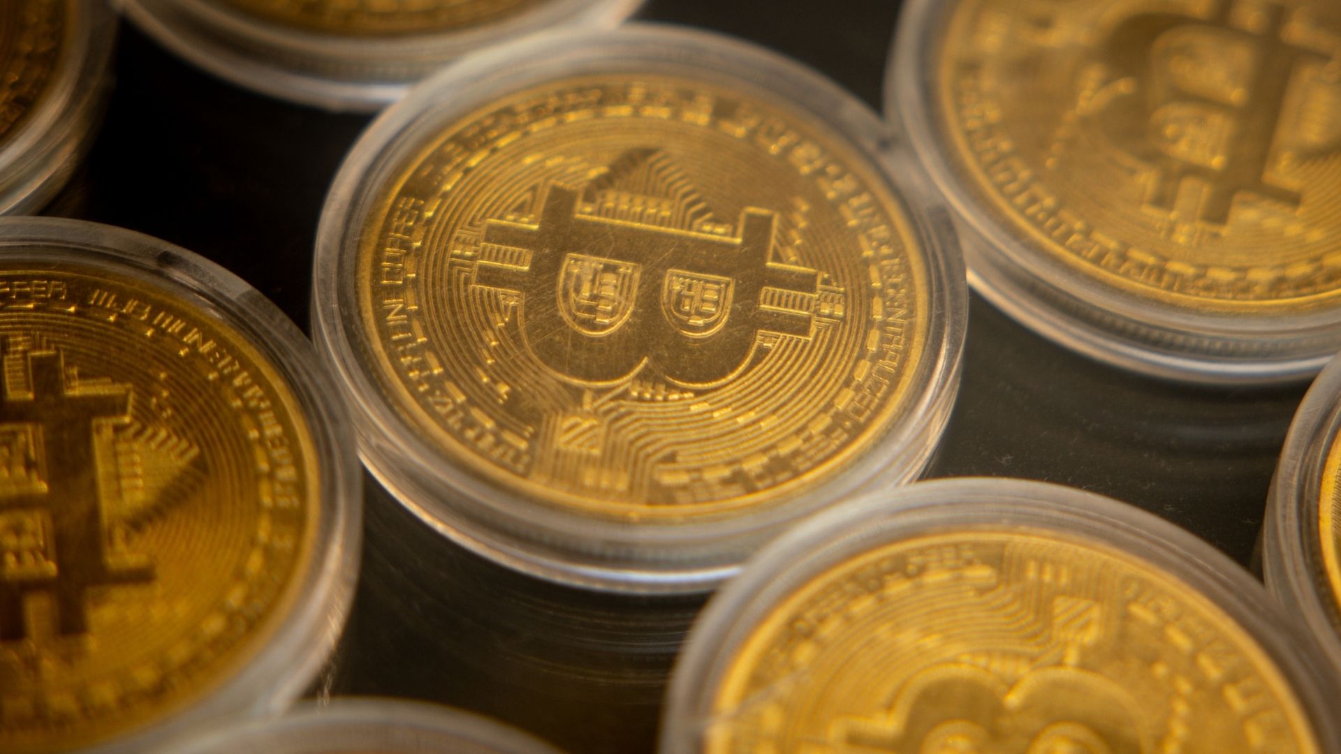 Gold Bitcoins are seen in the window of a Bitcoin and cryptocurrency exchange office on November 08, 2024 in Istanbul, Turkey. Bitcoin has soared to new record highs nearing 77,000 in the days after Donald Trump's re-election and on his campaign promise to support Bitcoin and the cryptocurrency market. 