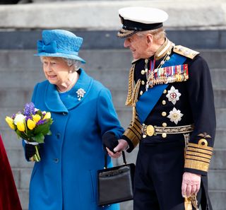 Queen Elizabeth II and Prince Philip, Duke of Edinburgh hold hands as they leave a Service of Commemoration to mark the end of combat operations in Afghanistan at St Paul's Cathedral on March 13, 2015 in London, England