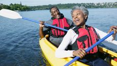 Bi-racial couple kayaking