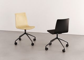 A black wooden office chair and a light beige office chair