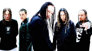 Korn posing for a photograph in 2004