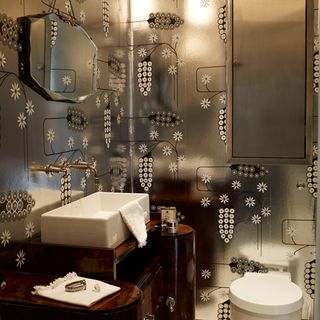 Bathroom with silver wallpaper