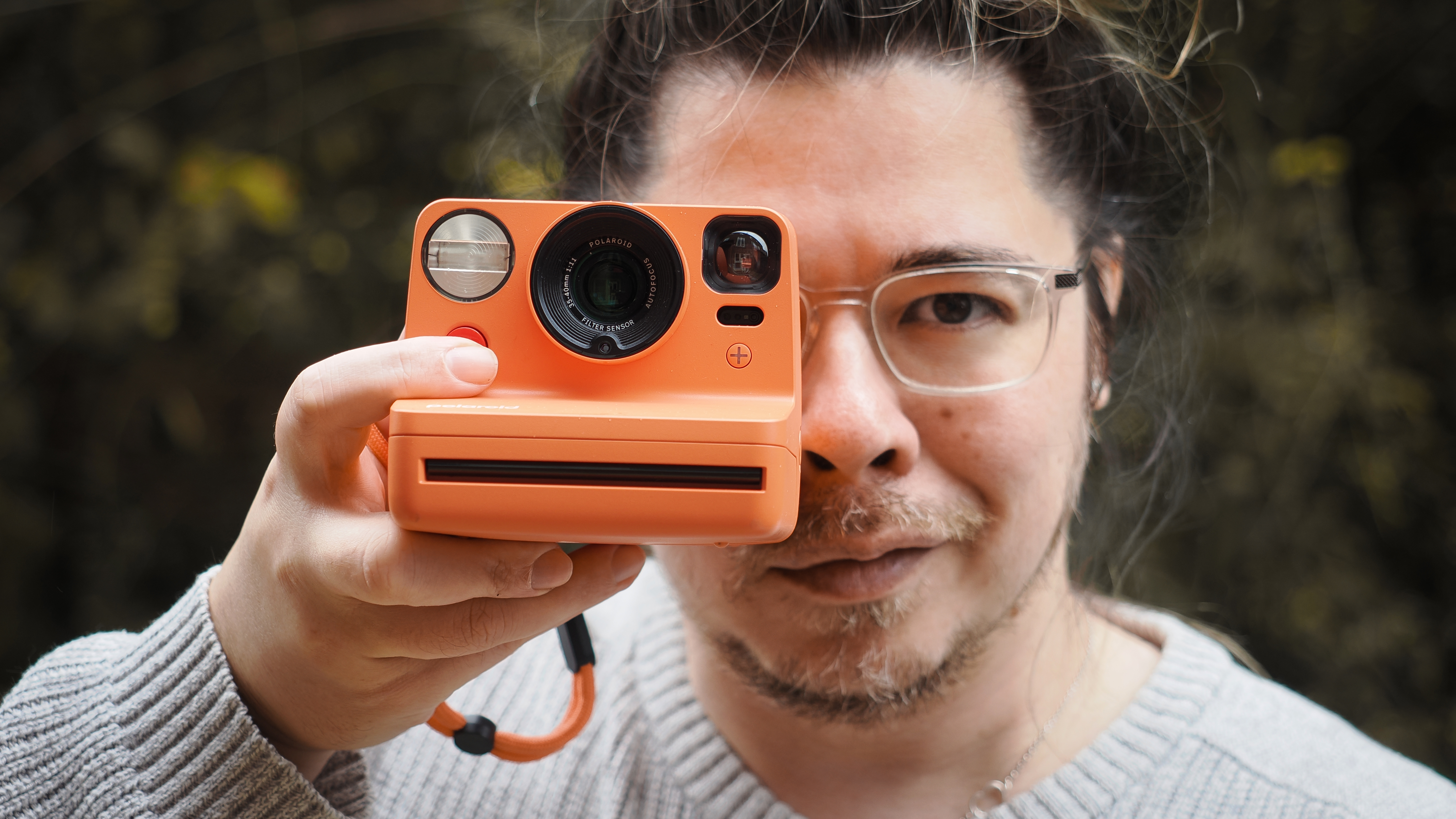 The Polaroid Now+ Gen 3 being held by photographer James Artaius