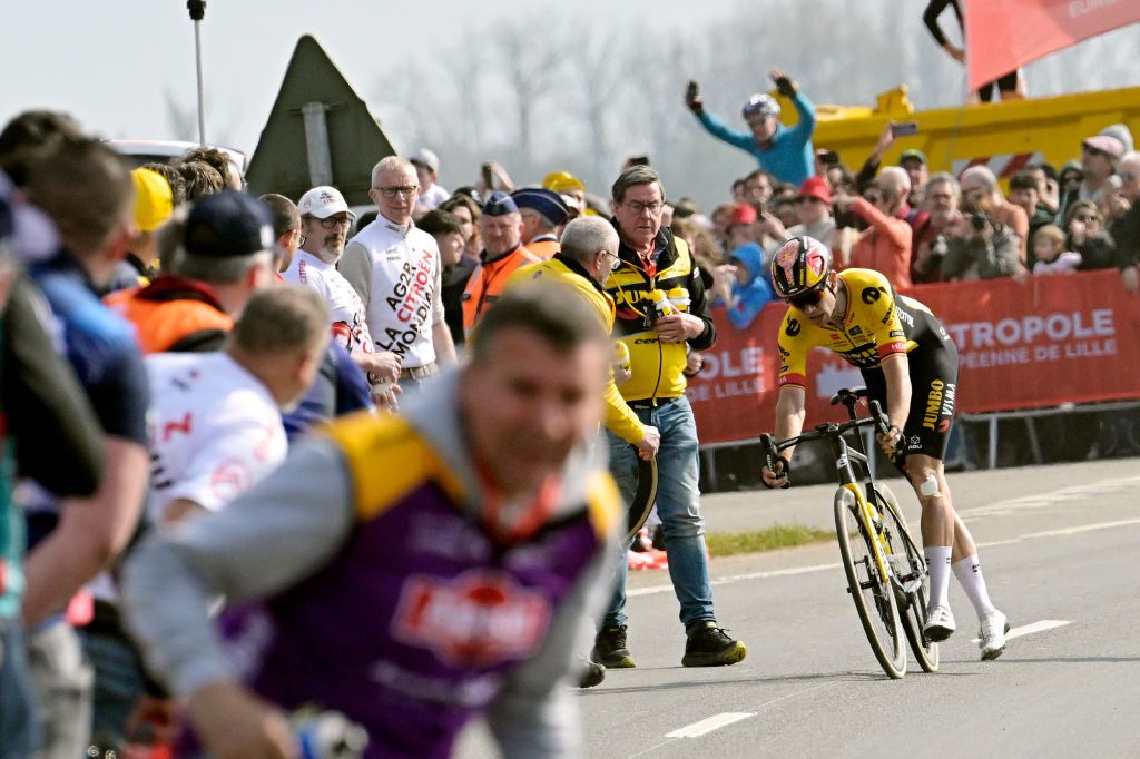 ROUBAIX FRANCE APRIL 09 Wout Van Aert of Belgium and Team JumboVisma with a flat tire looks for assistance in the final part of the race during the 120th ParisRoubaix 2023 Mens Elite a 2566km one day race from Compigne to Roubaix on UCIWT April 09 2023 in Roubaix France Photo by Bernard Papon PoolGetty Images