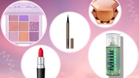 products in the best Cyber Monday makeup deals 2022—including Huda Beauty lilac palette, MAC red lipstick, Hourglass liquid eyeliner pen, Fenty Beauty highlight powder and Milk Makeup Hydro Grip primer—on a purple and pink cloud background