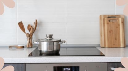Glass stovetop with stainless steel pan in kitchen with white tiles and white countertop, used to illustrate a guide on how to clean a glass stovetop