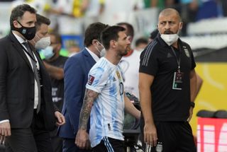 Argentina’s Lionel Messi leaves the pitch after Sunday's match was suspended