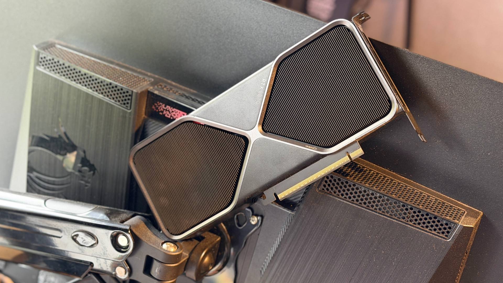 Someone has tried to jam a full size Nvidia GeForce RTX 5060 into the back of a MSI gaming monitor. It was not to be.