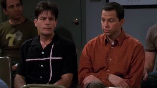 Charlie Harper (Charlie Sheen) and Alan Harper (Jon Cryer) look embarrassed during a meeting on Two and a Half Men.