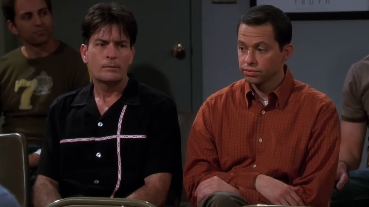 Charlie Harper (Charlie Sheen) and Alan Harper (Jon Cryer) look embarrassed during a meeting on Two and a Half Men.