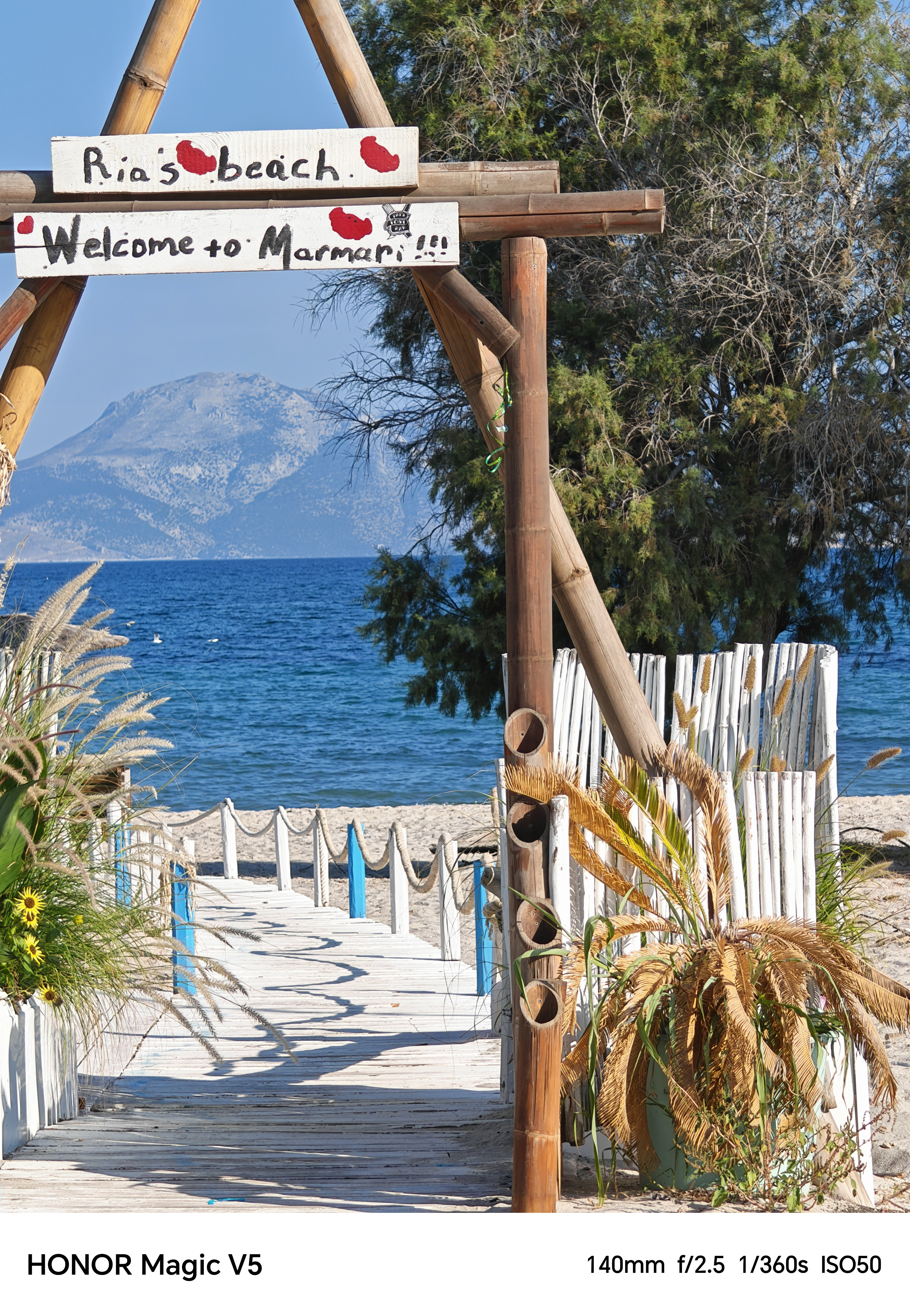 A beach and ocean scene through an archway